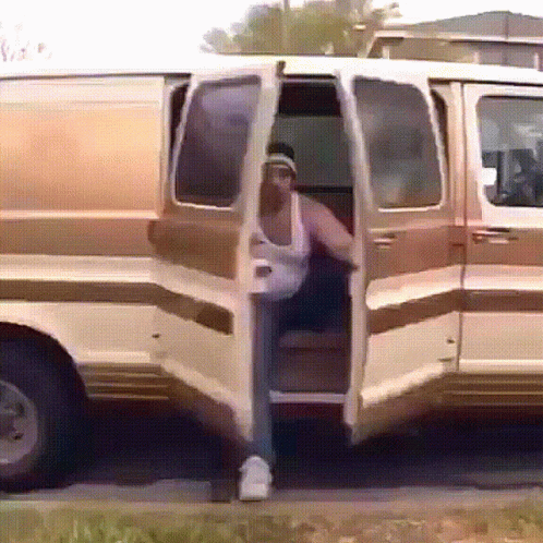 Group of People Sitting in Van With Doors Open