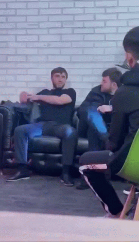 Group of People Sitting on Couch Talking