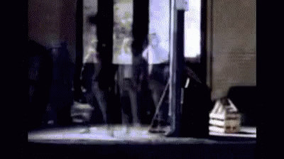 Group Of People Standing In Front Of Building GIF