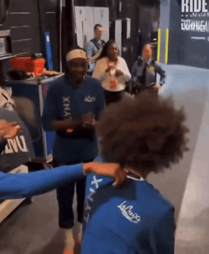 Group Of People Standing With Ride Sign GIF