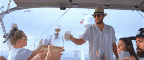 Group of People Toasting with Wine on Boat
