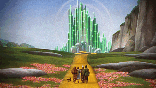 Group Of People Walking Down Yellow Road Towards Green Castle GIF