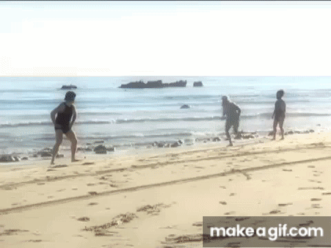 Group of People Walking on Beach