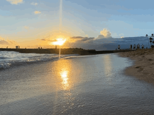 Group Of People Watching Sunset On Beach GIF