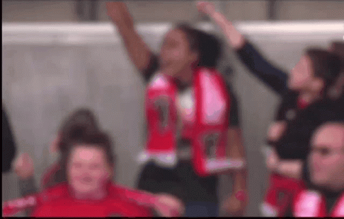 Group of People with Arms in Air