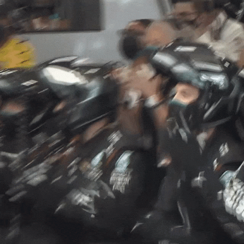 Group of People With Helmet Saying Boston Eagle