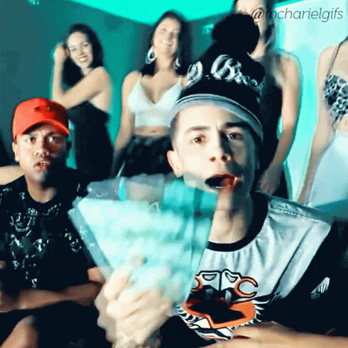 Group Of People With Man In MC Shirt GIF