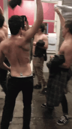 Group of Shirtless Men Standing