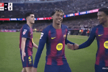 Group of Soccer Players Celebrating Goal With Number 5