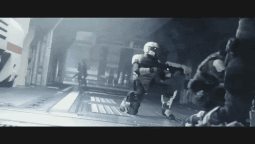 Group Of Soldiers Walking Down Hallway With Guns GIF