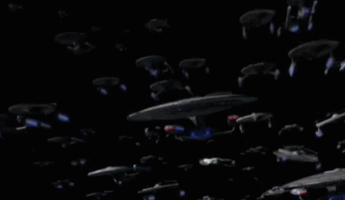 Group of Spaceships Flying in Dark Space
