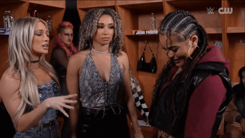 Group of Women in Locker Room with CW Logo