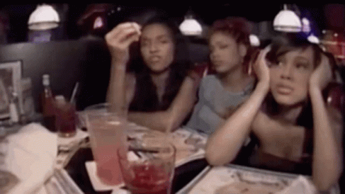 Group Of Women Sitting At Diner Table With Drinks GIF