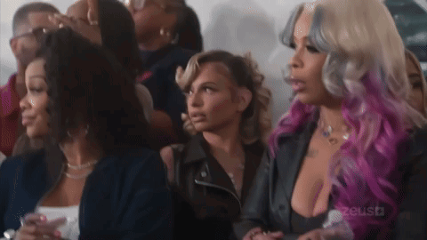 Group of Women Sitting in Crowd
