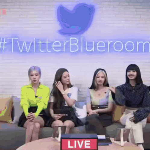 Group of Women Sitting on Couch in Front of Twitter Blueroom Sign