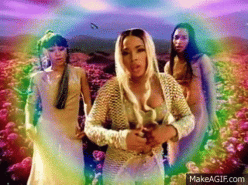Group Of Women Standing In Front Of A Field Of Flowers GIF
