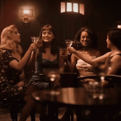 Group of Women Toasting at Table