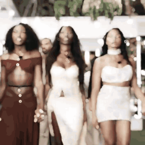 Group Of Women Walking On Runway GIF