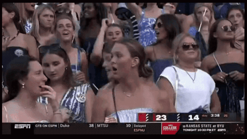 Group of Women Watching ESPN With Score 23-14