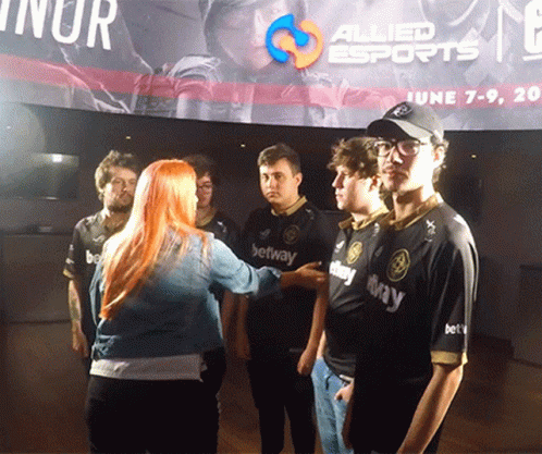 Group of Young Men at Allied Esports Banner