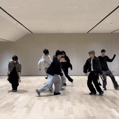 Group of Young Men Dancing in Room