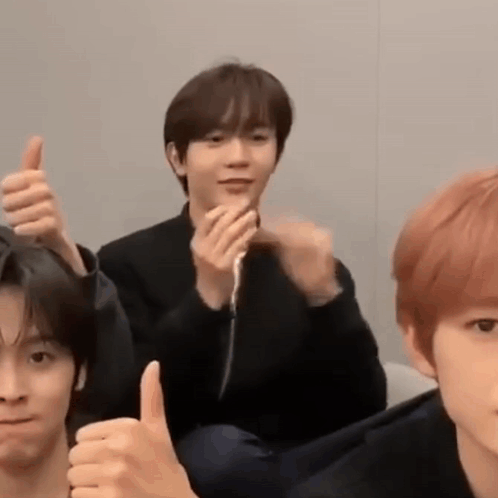 Group of Young Men Giving Thumbs Up
