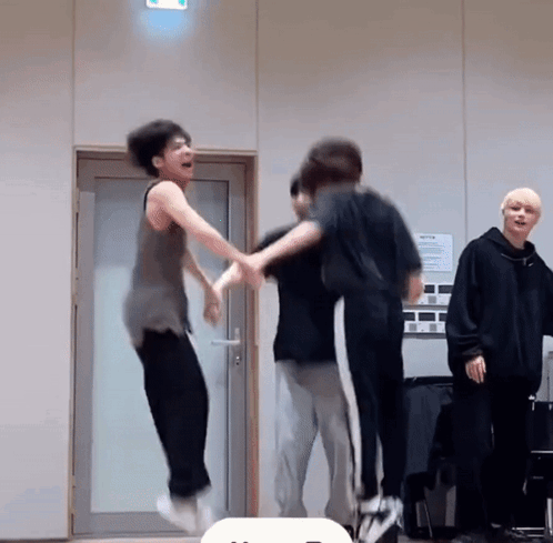 Group Of Young Men Jumping In The Air GIF