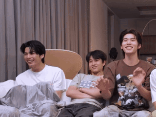 Group of Young Men Laughing on Couch