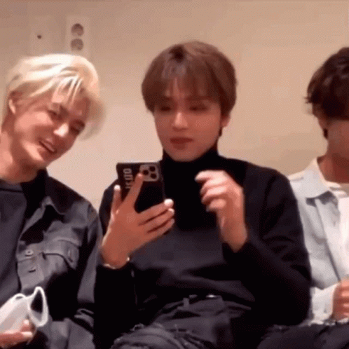 Group Of Young Men One Holding Cell Phone GIF