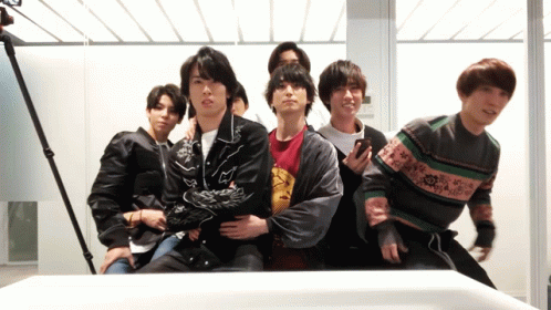 Group of Young Men Posing in Front of Mirror