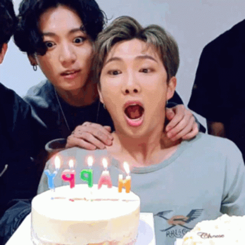 Group of Young Men Posing With Birthday Cake