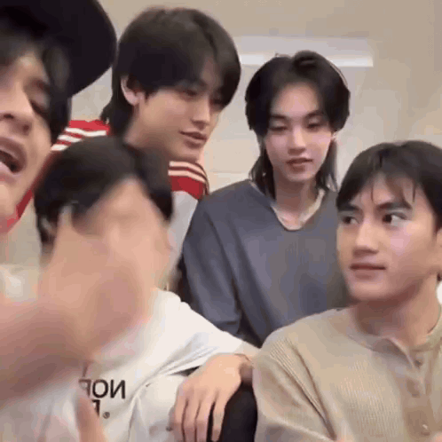 Group of Young Men Sitting and Talking