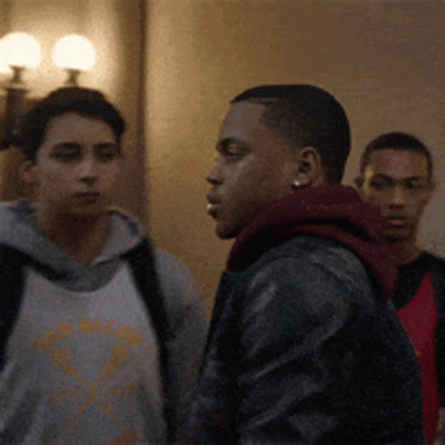 Group Of Young Men Standing In Hallway GIF