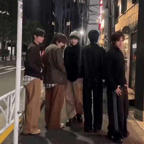 Group of Young Men Standing on Street