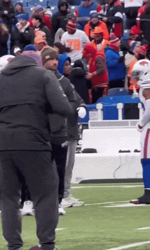 Group On Football Field With Man In Number 78 T-Shirt GIF
