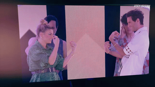 Group On TV Screen With AX Letters GIF