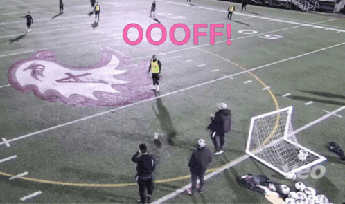 Group Playing Soccer With Pink Word Oooff