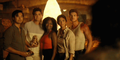 Group Posing for Picture in Front of Light