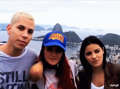 Group Posing for Picture With Blue NBA Hat