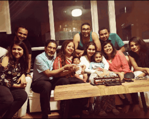 Group Posing With Cake GIF