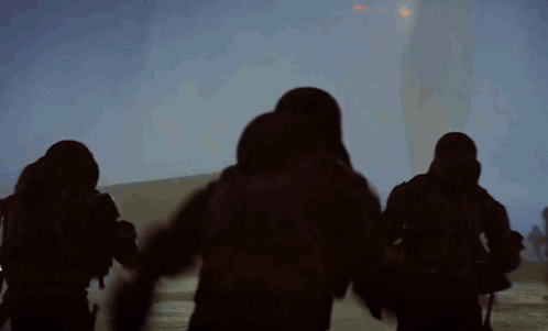 Group Running in Foggy Area With Sun
