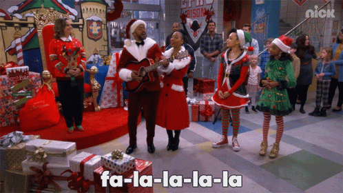 Group Singing Christmas Song With Nick Logo in Background