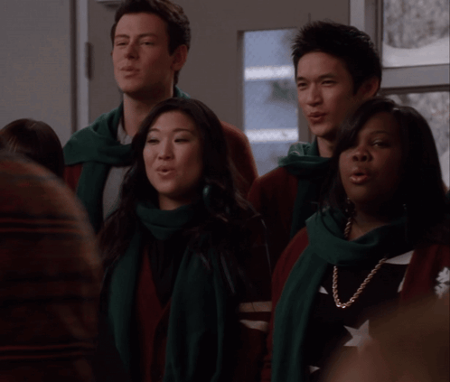 Group Singing in Scarves and Sweaters