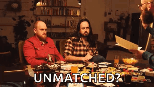 Group Sitting Around Table Playing Game Asking If Unmatched
