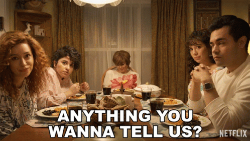 Group Sitting Around Table Saying Anything You Wanna Tell Us GIF