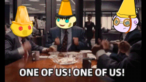 Group Sitting Around Table Saying One of Us One of Us
