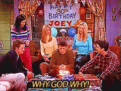 Group Sitting Around Table Saying Why God Why