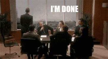 Group Sitting Around Table With I'm Done On Wall GIF