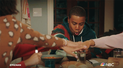 Group Sitting At Table With NBC GIF