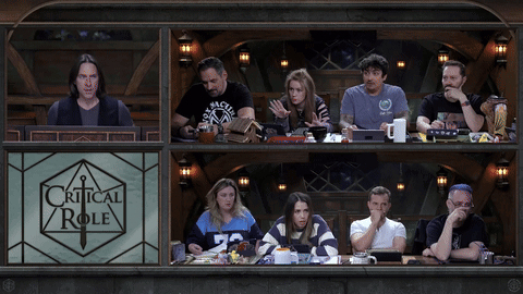 Group Sitting In Front Of Critical Role Sign GIF